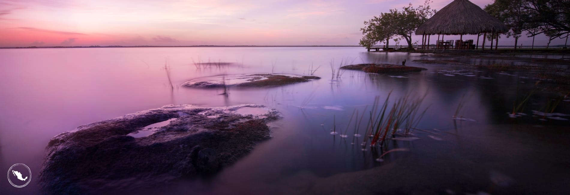 Sunset over the water in Bacalar - Bacalar Visitors Guide