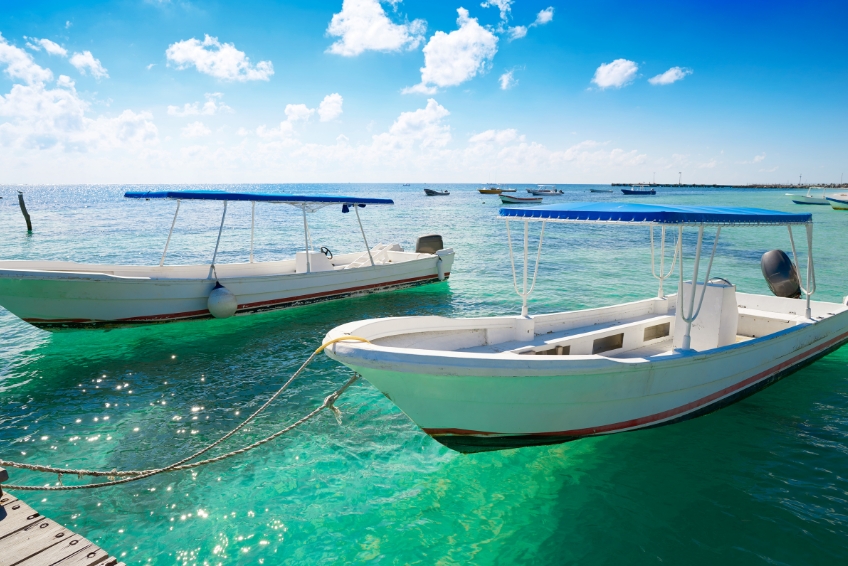 Boats on turquoise waters in Puerto Morelos