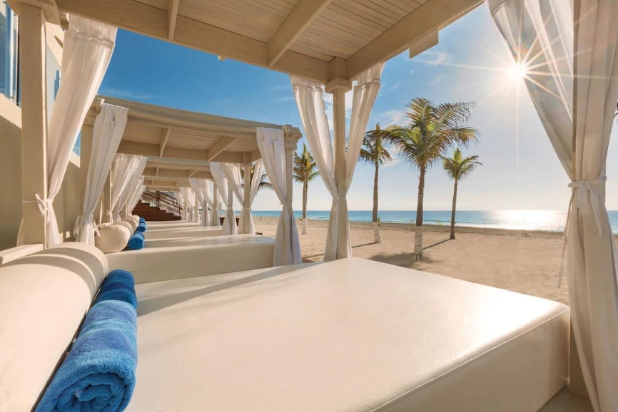 Beach lounge cabanas at the Wyndham Alltra Cancun Resort & Spa