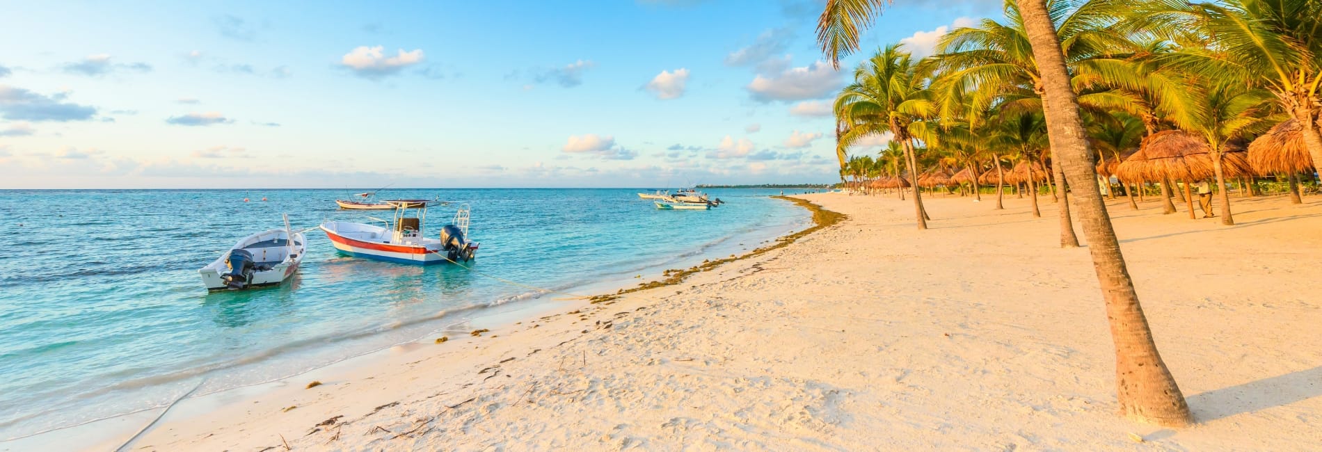 Boats docked near a beach in Cancun