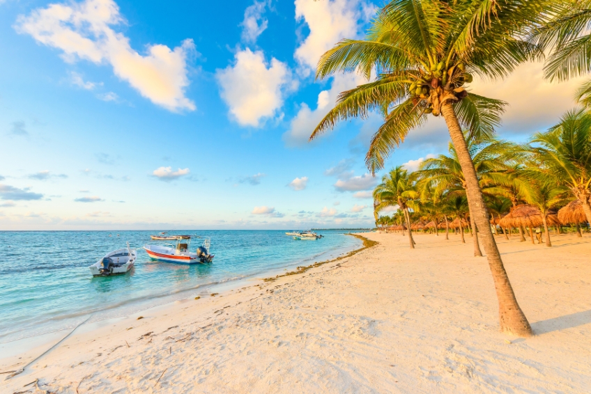 Boats docked near a beach in Cancun
