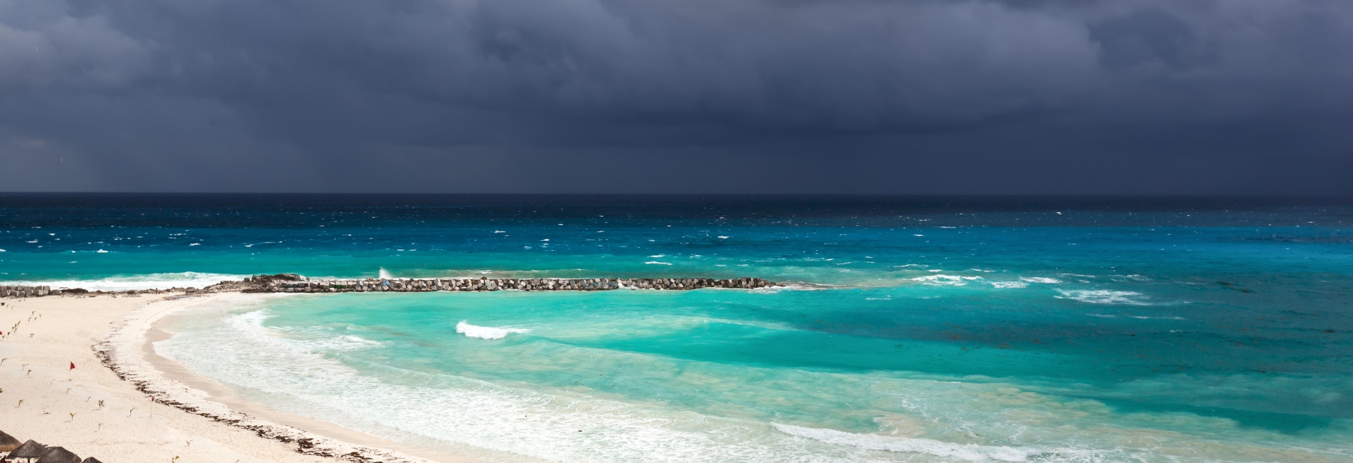 Storm clouds over a Cancun beach